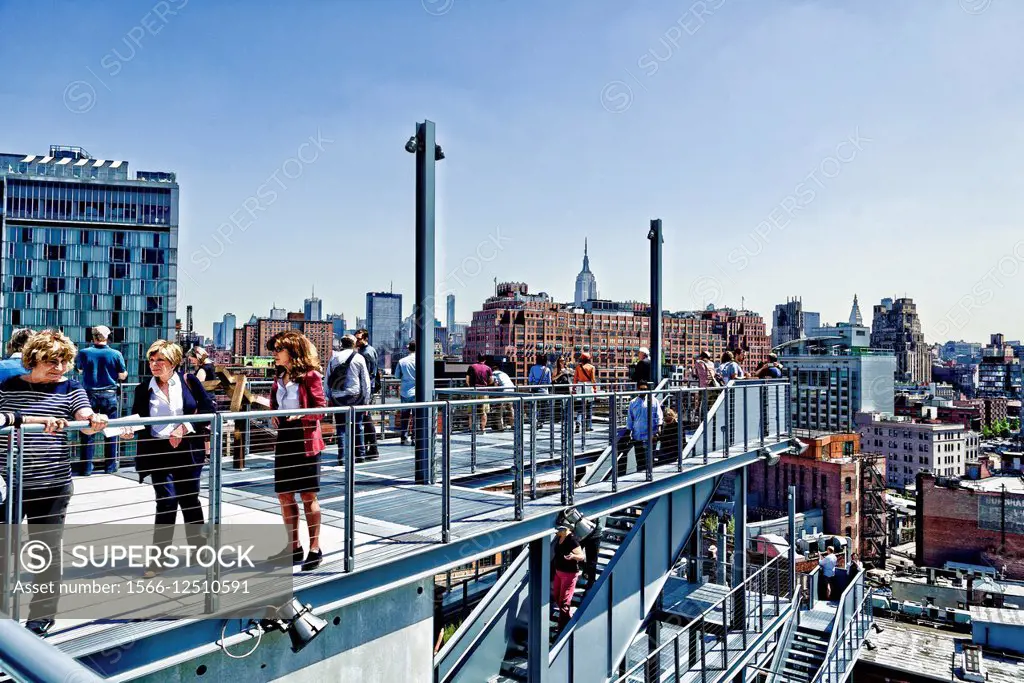 People enjoying the Outdoor Terraces on many levels, at the Whitney Museum Meatpacking District, New York City. Building designed by Renzo Piano, arch...