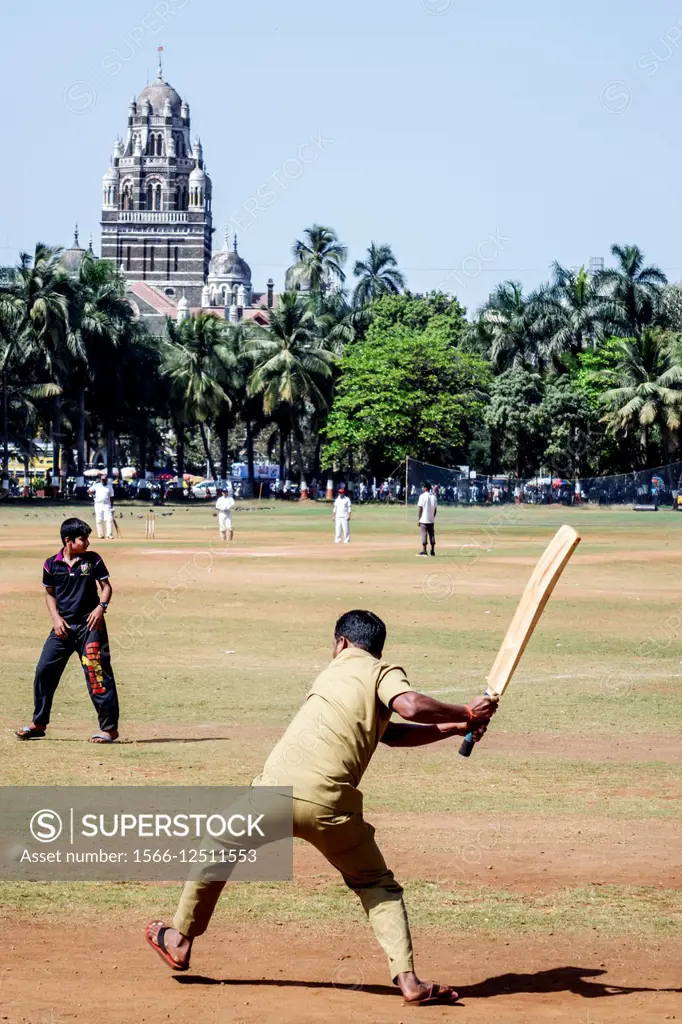 India, Asian, Mumbai, Churchgate, Oval Maidan, Maharshi Karve Road, cricket field, pitch, man, Western Railway Headquarter.