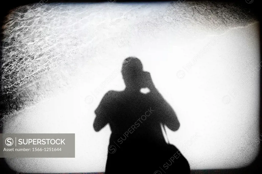 silhouette of a man self-portrait photographer taking a picture