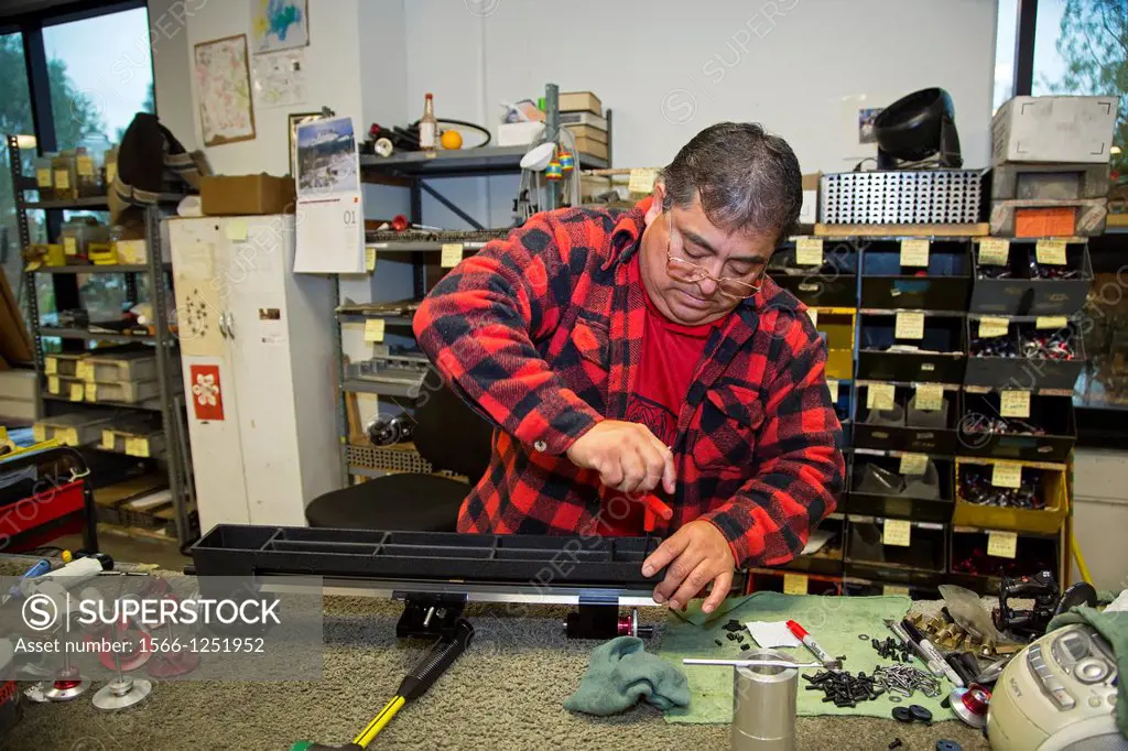Vista, California - A worker assembles a lathe at Sherline Products  The company manufactures small lathes and other machine shop tools