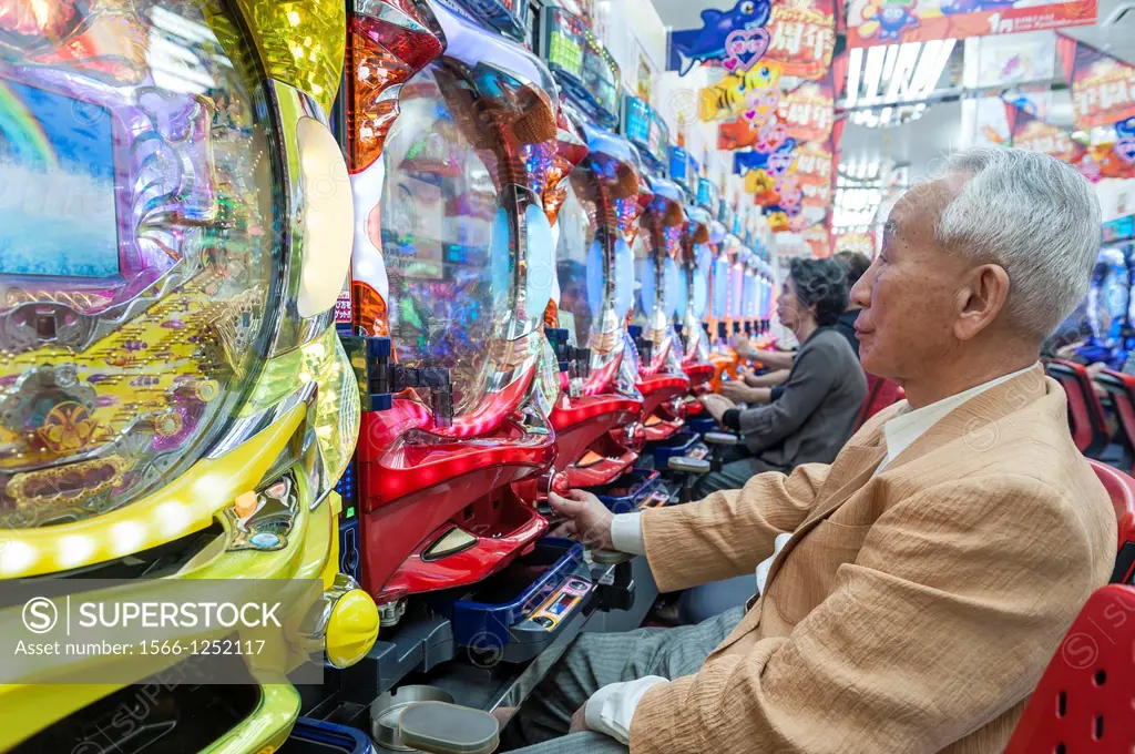 People playing pachinko, a very popular game in Japan, Tokyo, Asia