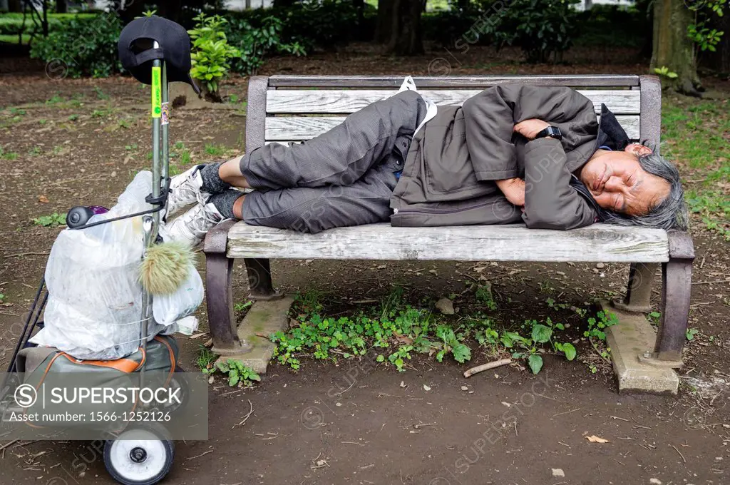 Homeless sleeping on a bench, Yoyogi park, Tokyo, Japan, Asia