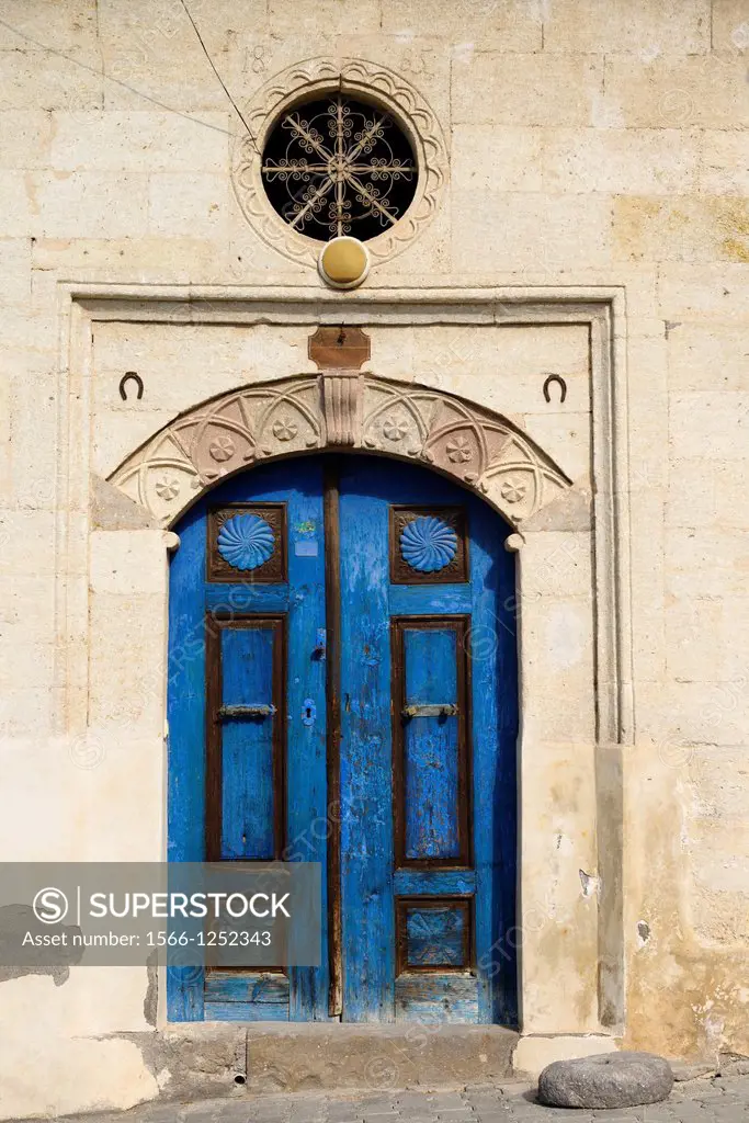 Deep blue door of stone house in Mustafapasa village Cappadocia Turkey