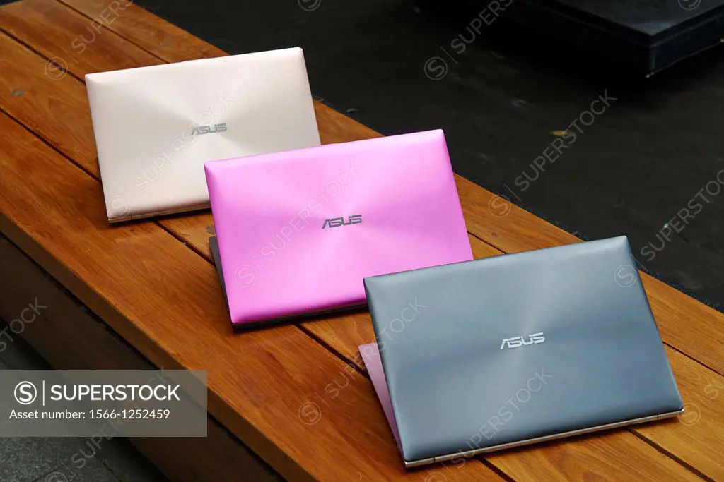 The ASUS Zenbook, an ultra-thin laptop with a metallic finish, stereo speakers, and backlit keys