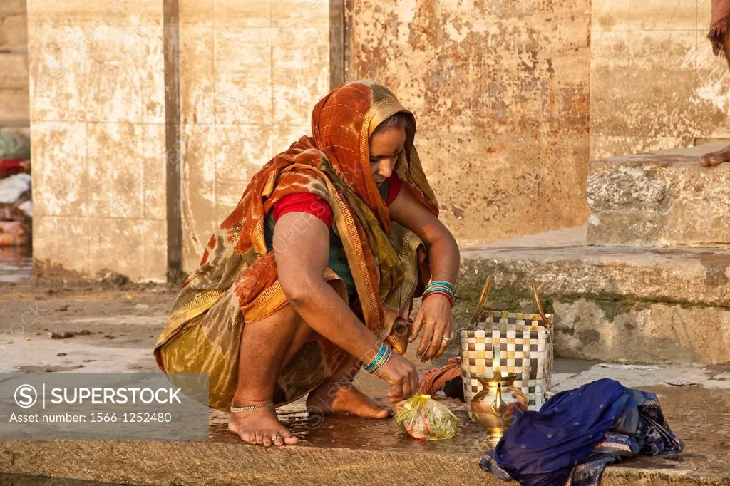 The Ghats, Hindu Woman Washing in the Holy Ganges River, Varanasi, Uttar Pradesh, India