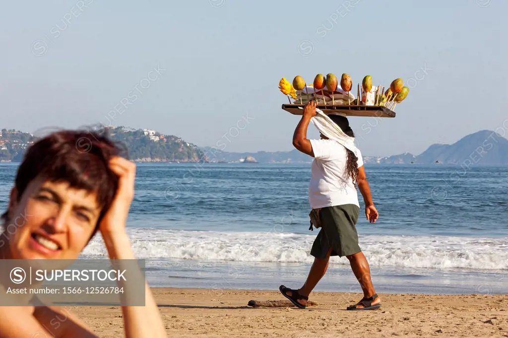 Woman selling fruit. Manzanillo beach. Pacific Ocean. Colima. Mexico.