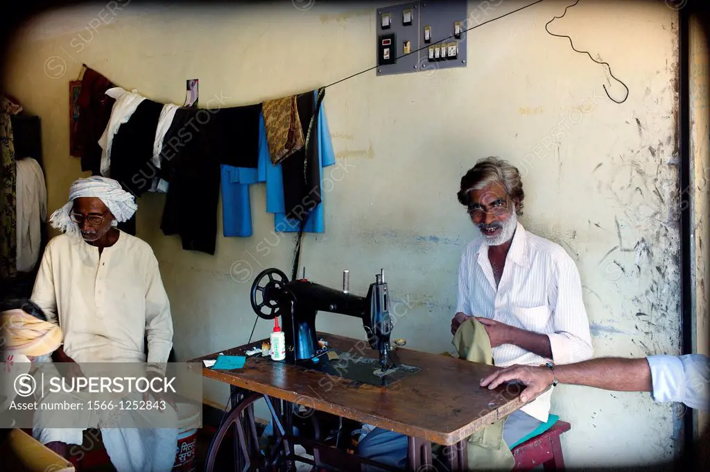 Tailor sewing with a sewing machine in Mundgod, Karnataka, India