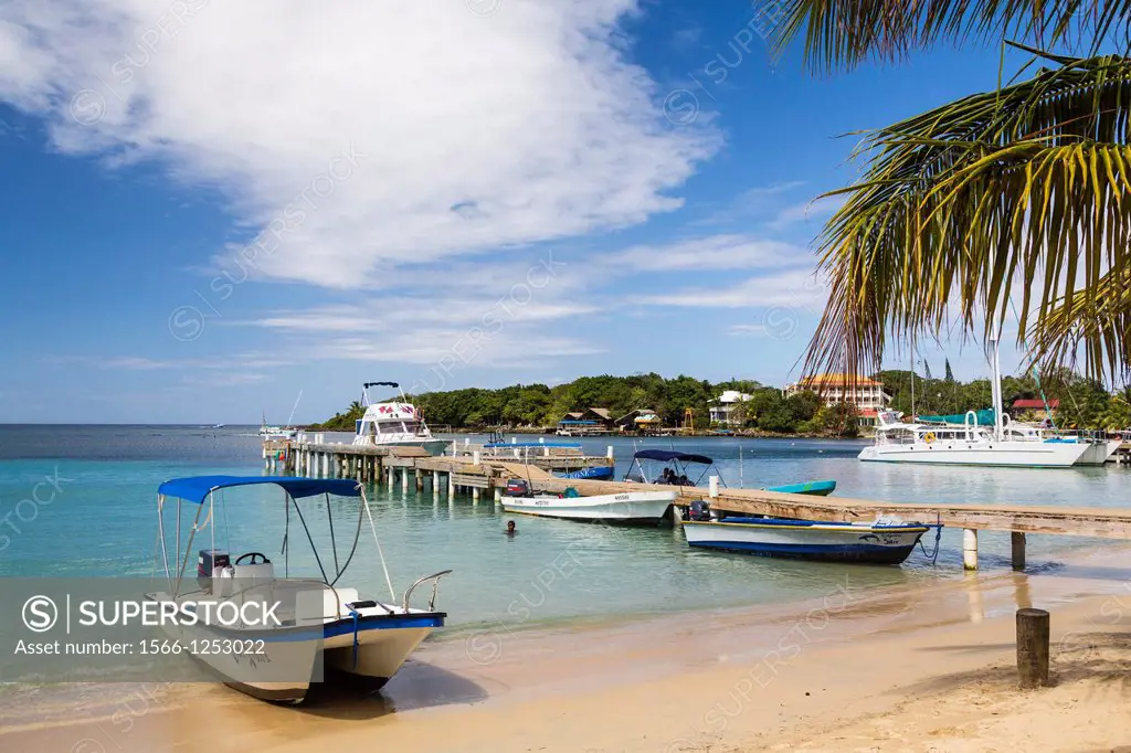 The beach, pier, restaurants and boats at West End in Roatan, Honduras