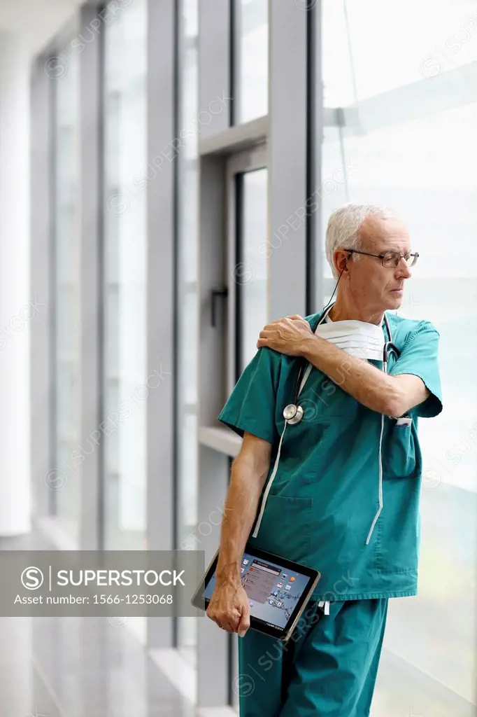 surgeon with tablet in the operating room hallway, Onkologikoa Hospital, Oncology Institute, Case Center for prevention, diagnosis and treatment of ca...