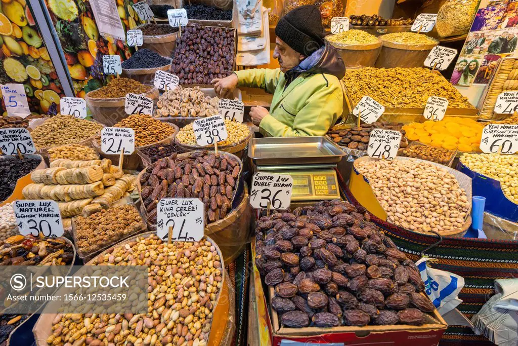 Nuts, dried fruits and spices on a stall at the spice bazaar, Eminonu, Istanbul, Turkey.