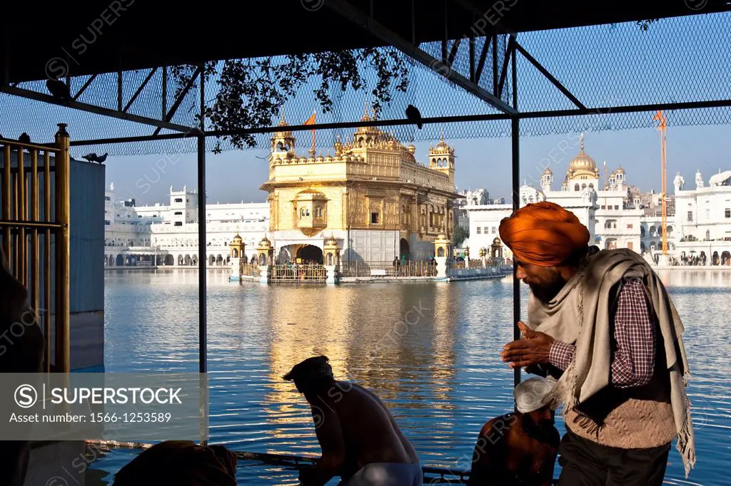 Pilgrims preparing to bathe in the lake, The Golden Temple of Amritsar, aka The Harmandir Sahib or Hari Mandir Punjab, India