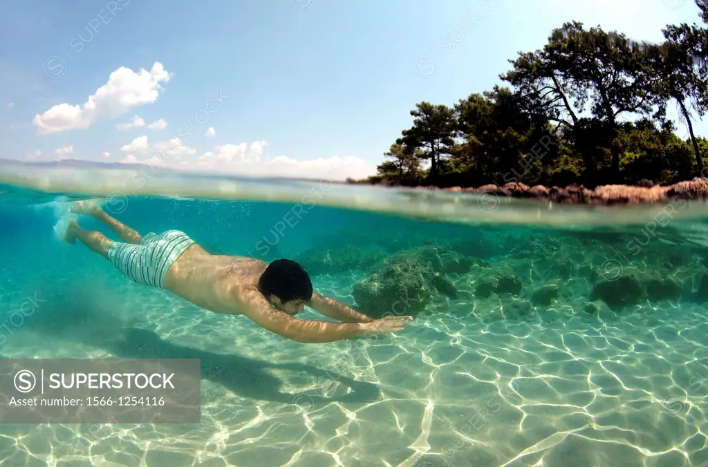Man diving, Cleopatra island Sedir Island, Aegean Sea, Turkey,