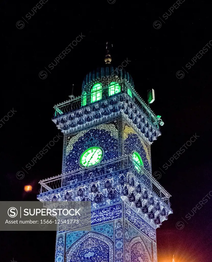 A picture of Lighthouse clock tower in Al-Kadhimiya Mosque, It is decorated with carvings Islamist And it contains a large Hour and Koranic verses wri...