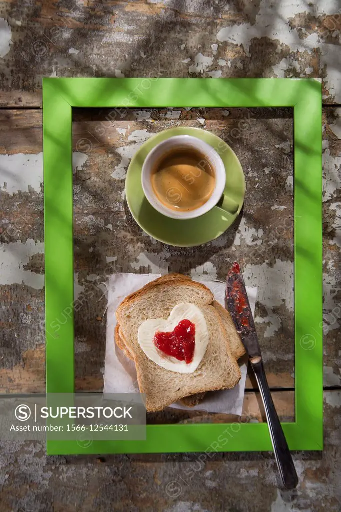 presentation of a breakfast of coffee, bread, butter and jam.