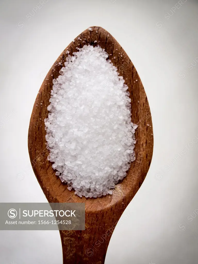Salt in a wooden spoon.