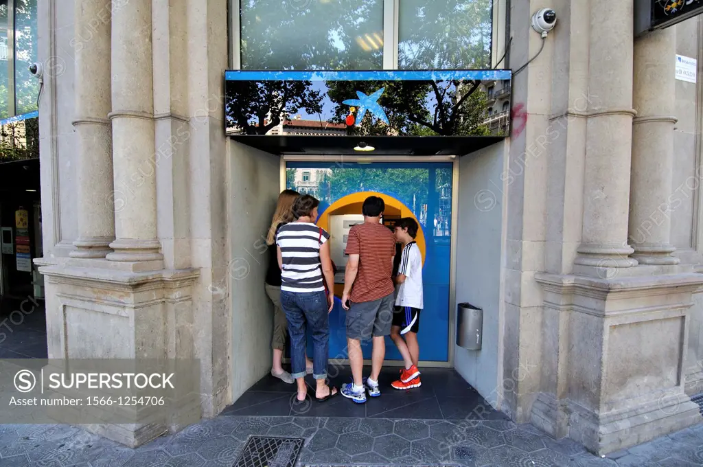 People using an ATM, Barcelona, Catalonia, Spain