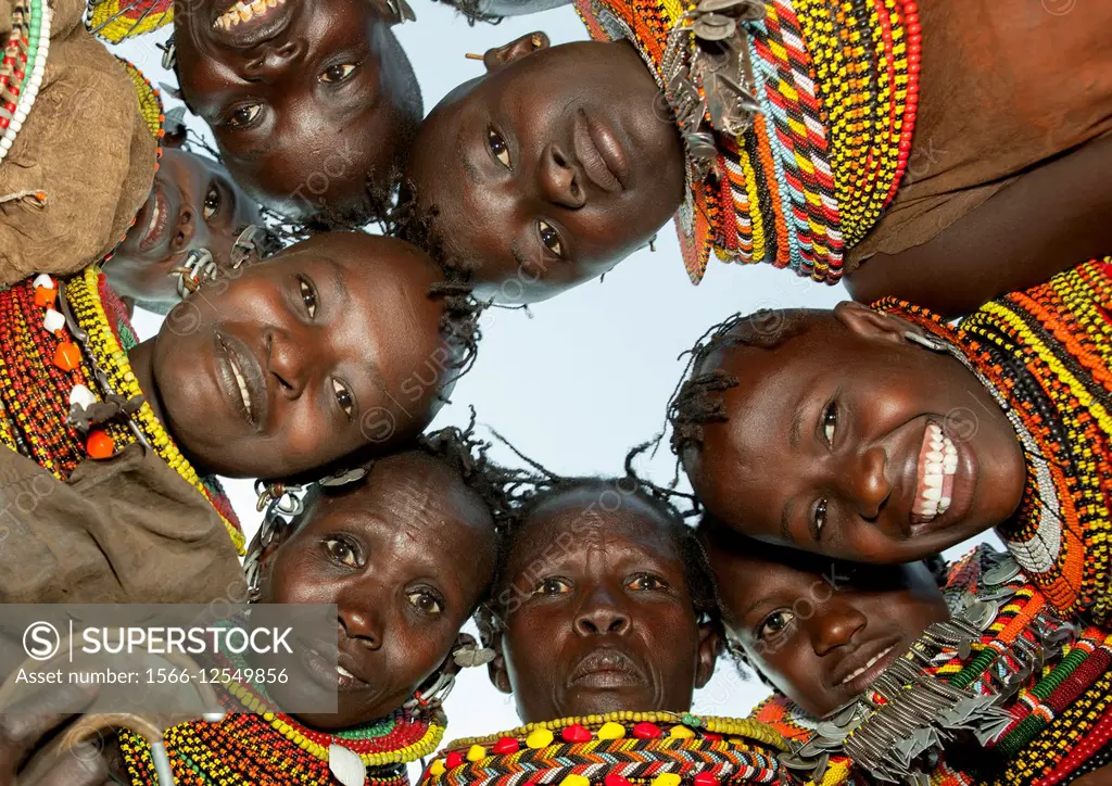 Turkana Tribeswomen In Circle Looking Down, Turkana Lake, Loiyangalani, Kenya.