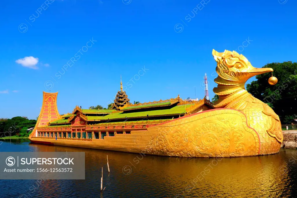 Luxurious royal barge with bird´s head on calm water in Myanmar.