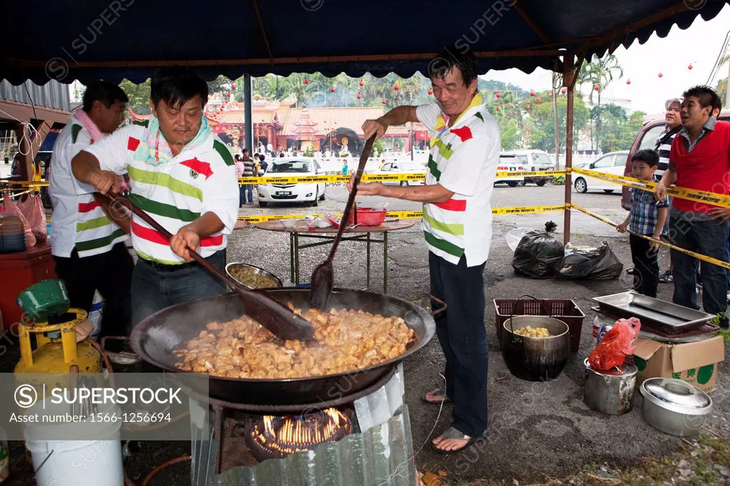 Volunteers cooking vegetarian food for the worshippers during the Chinese New Year Celebration in Siniawan, Sarawak, Malaysia.