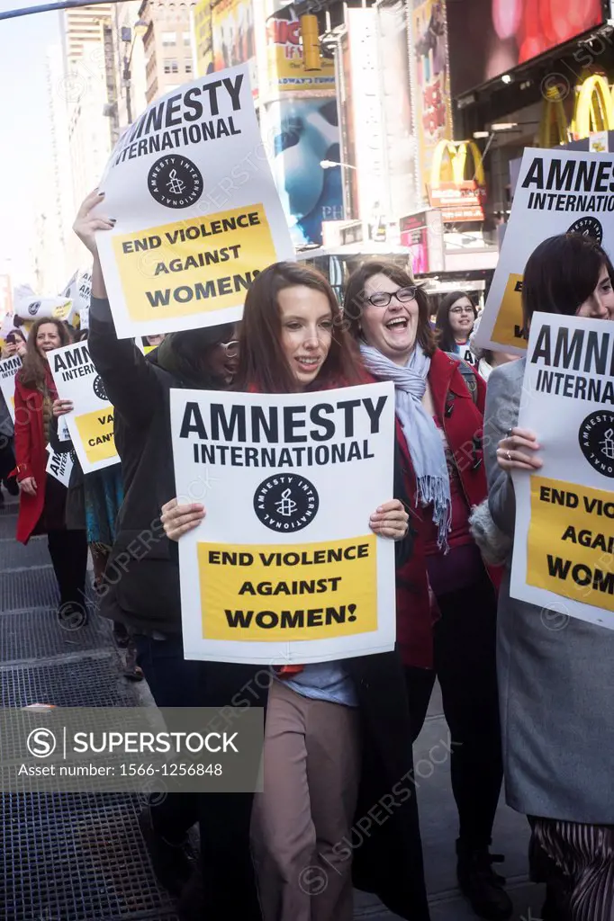 Members of Amnesty International on their supporters rally in Times Square in New York in support of the domestic and international Violence Against W...