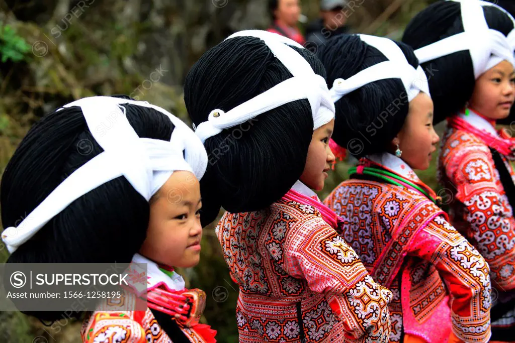 Long Horn Miao teenage girls dancing during the annual Tiao Hua festival in western Guizhou