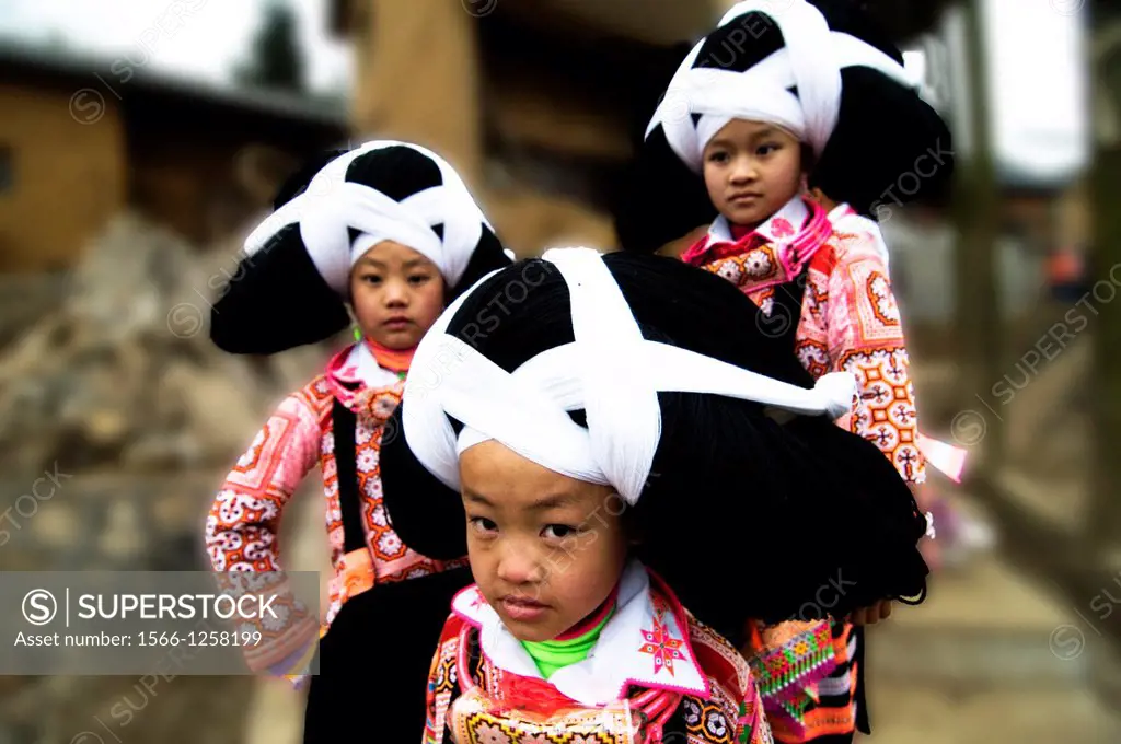 Long Horn Miao teenage girls in their village in western Guizhou, China