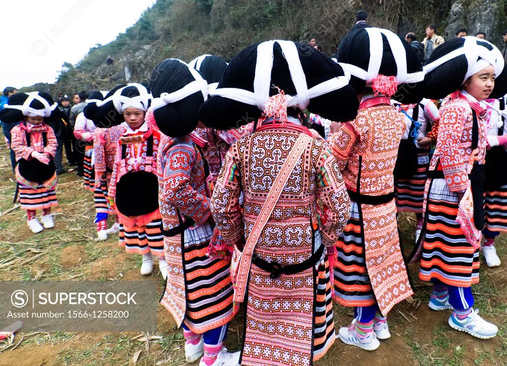 Long Horn Miao teenage girls dancing in the annual Tiao Hua festival in western Guizhou, China