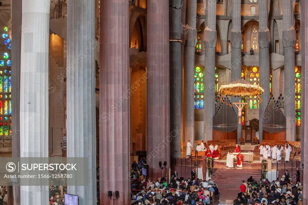 Mass,Interior of Basilica Sagrada Familia,nave and apse, Barcelona, Catalonia, Spain