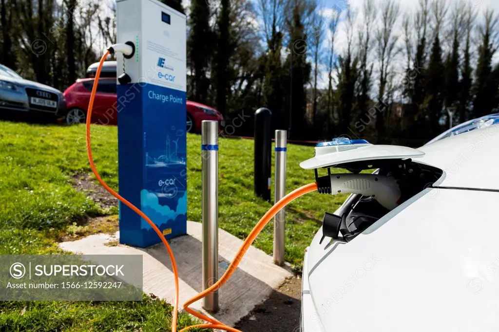 A Nissan Leaf electric car charging at a charge point in the car park of the Ulster Transport Museum, Holywood, Co. Down. Shooting Date 11/04/2015