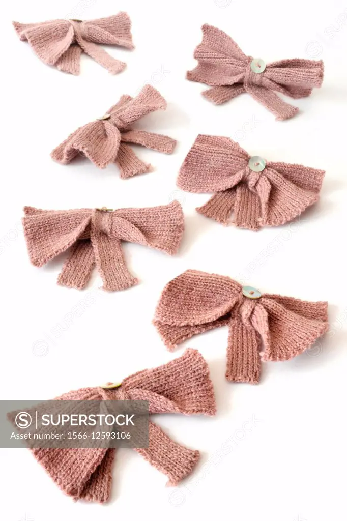 lavendar knitted ribbons on a white background