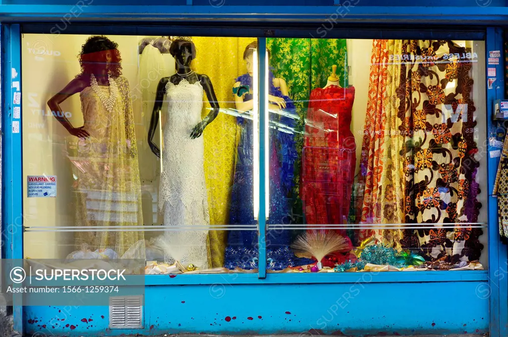 Window of a fashion store with three mannequins
