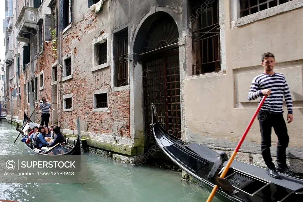 Italy, Venice, in a water taxi (motoscafo) on the canals.