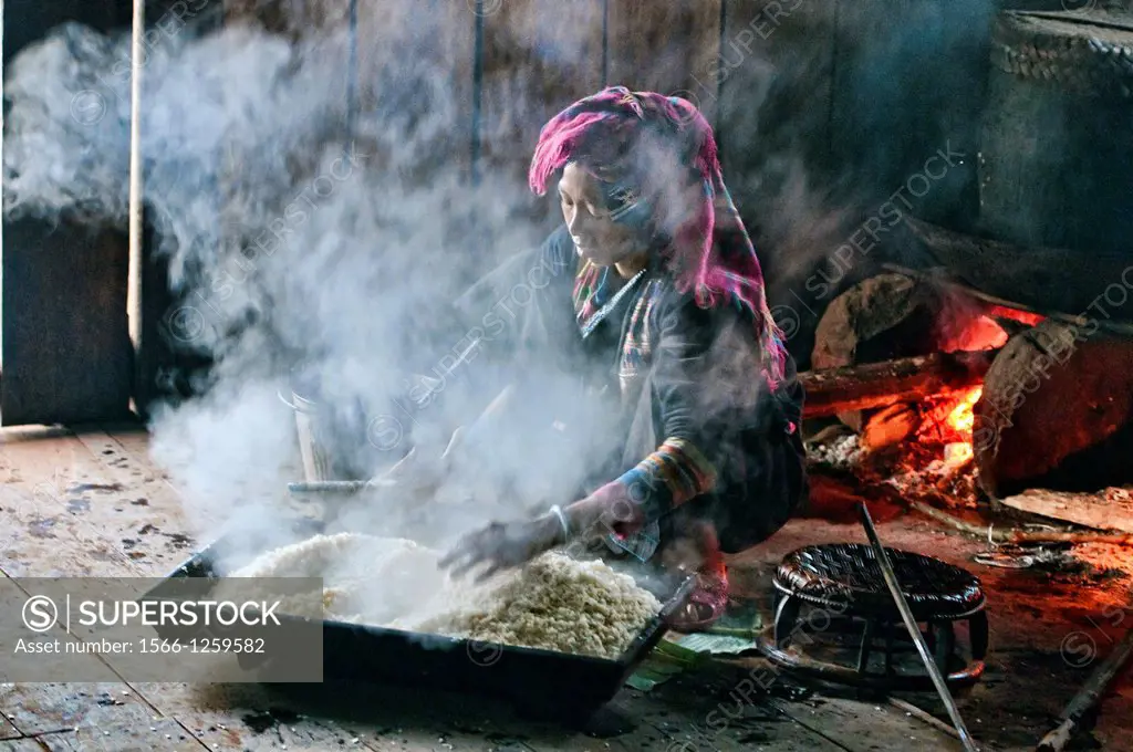 Akha woman preparing rice, Phongsaly, Laos