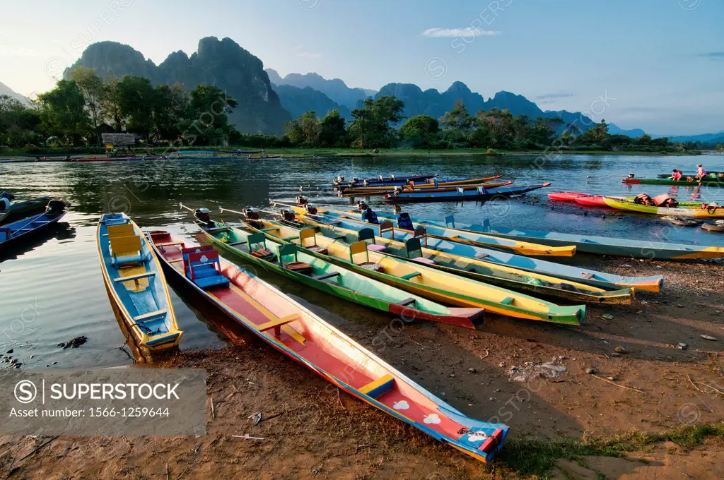 boats along the Nam Song River in Vang Vieng, Laos