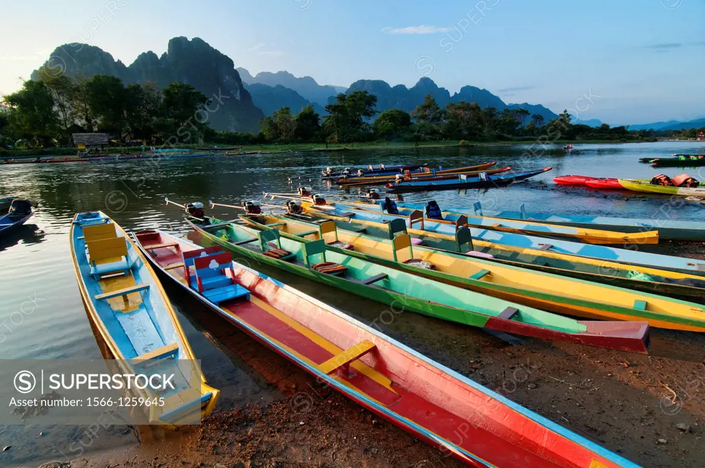 boats along the Nam Song River in Vang Vieng, Laos