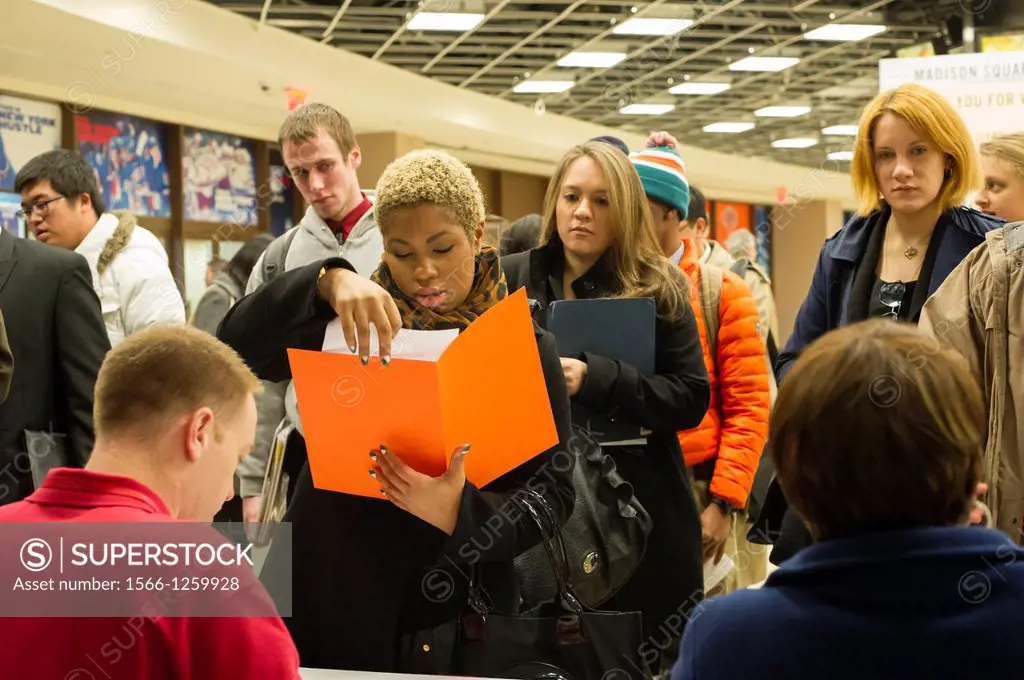 Job seekers attend a Career Fair in New York The US Labor Department reports new claims for unemployment benefits for last week dropped 22, 000 to a s...