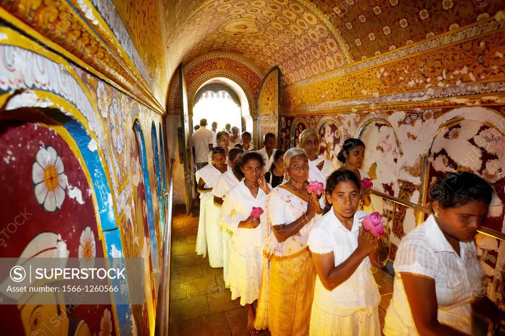 Sri Lanka - pilgrims in the Temple of the Tooth, Kandy, Sri Dalaga Maligawa - UNESCO World Heritage Site, buddish shrine, central region of Sri Lanka