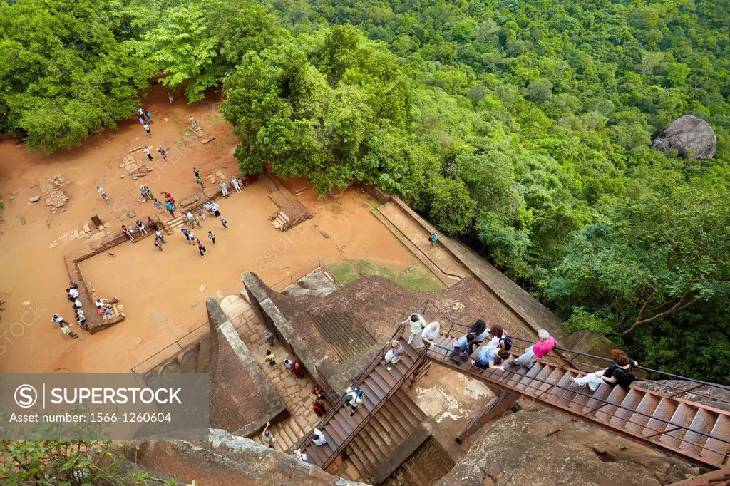 Sri Lanka - Sigiriya, tourists on stairs of Lion´s Gate to the ancient fortress, ancient Royal Fortress in Sri Lanka, UNESCO World Heritage Site