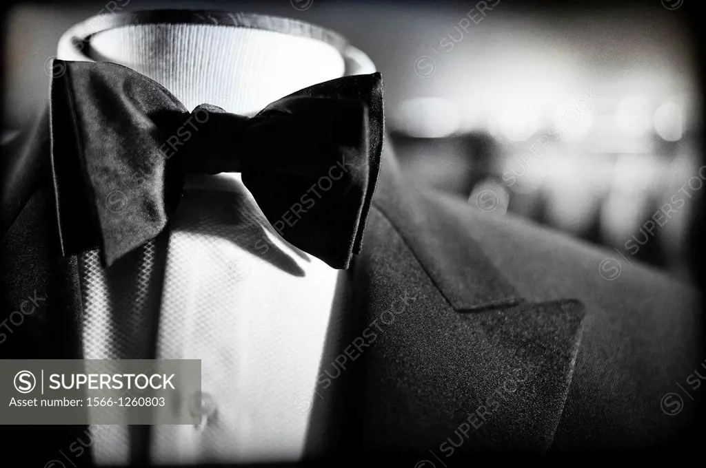 Close-up of suit with white shirt and bow tie on a mannequin