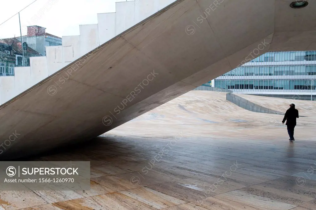 Person walk down the stair outside Casa da Musica in Port city, Portugal