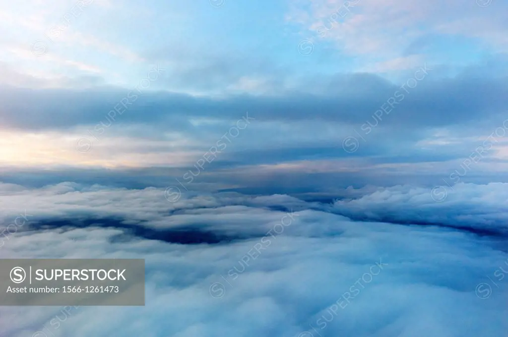 Aerial image of blue clouds and atmosphere from an airplane