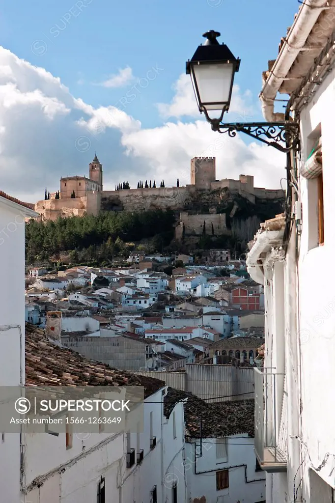 Typical street of Alcala la Real, Spain, in the background the castle of La Mota