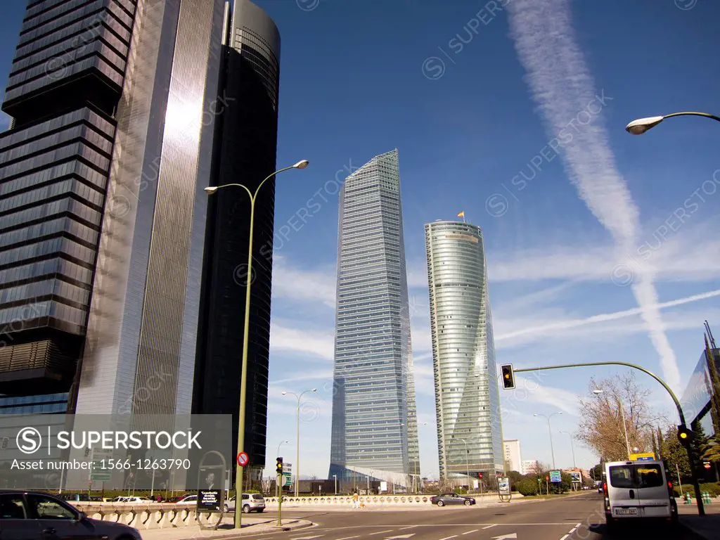 Jet Trails in sky over skyscrapers in North Madrid
