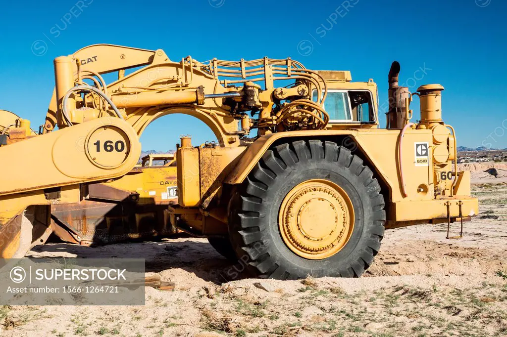 Laughlin, Nevada - March1: A Caterpillar whell tractor scraper stands at a construction site in Nevada awaiting the call to duty