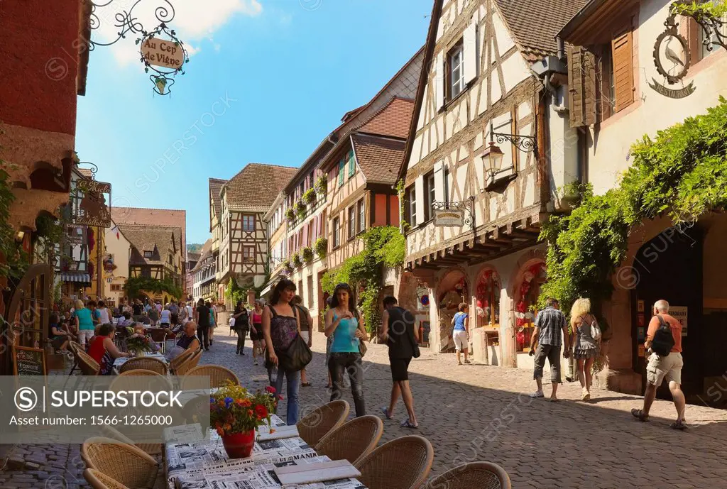 Tourists walking at the main street  Riquewihr  Alsace wine route  Haut-Rhin  Alsace  France
