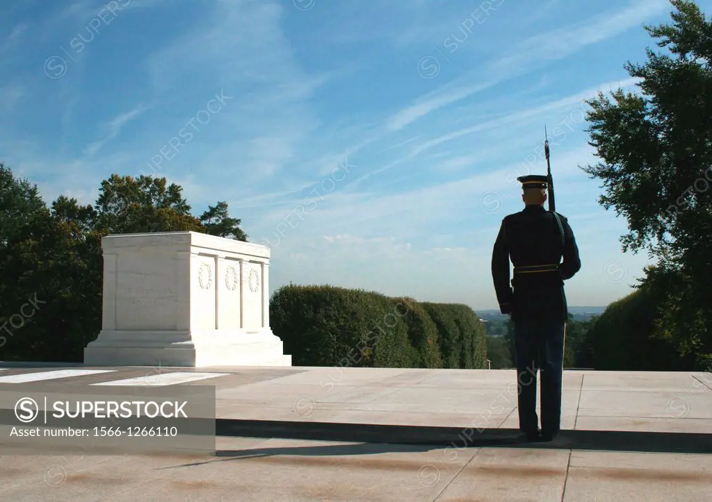 A member of the U S  Army honor guard pauses while walking his post at the Tomb of the Unknown Soldiers at Arlington National Cemetery, Arlington, Vir...