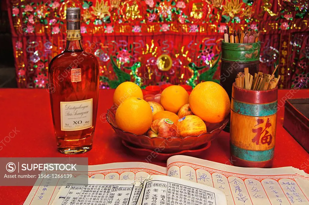 Armagnac bottle as an offer in a temple on the island of Cheung Chau, Hong Kong, China