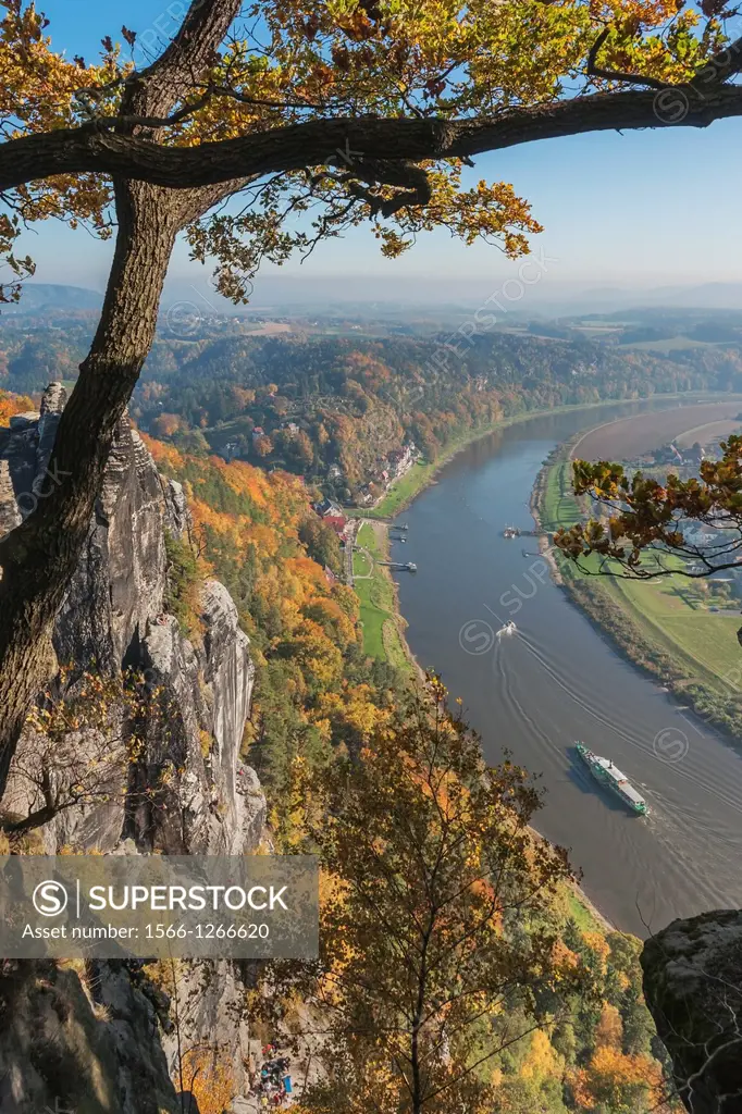 View from the spectacular rock formation Bastei (Bastion) to health resort Rathen and the Elbe River. The Bastei is one of the most visited tourist at...