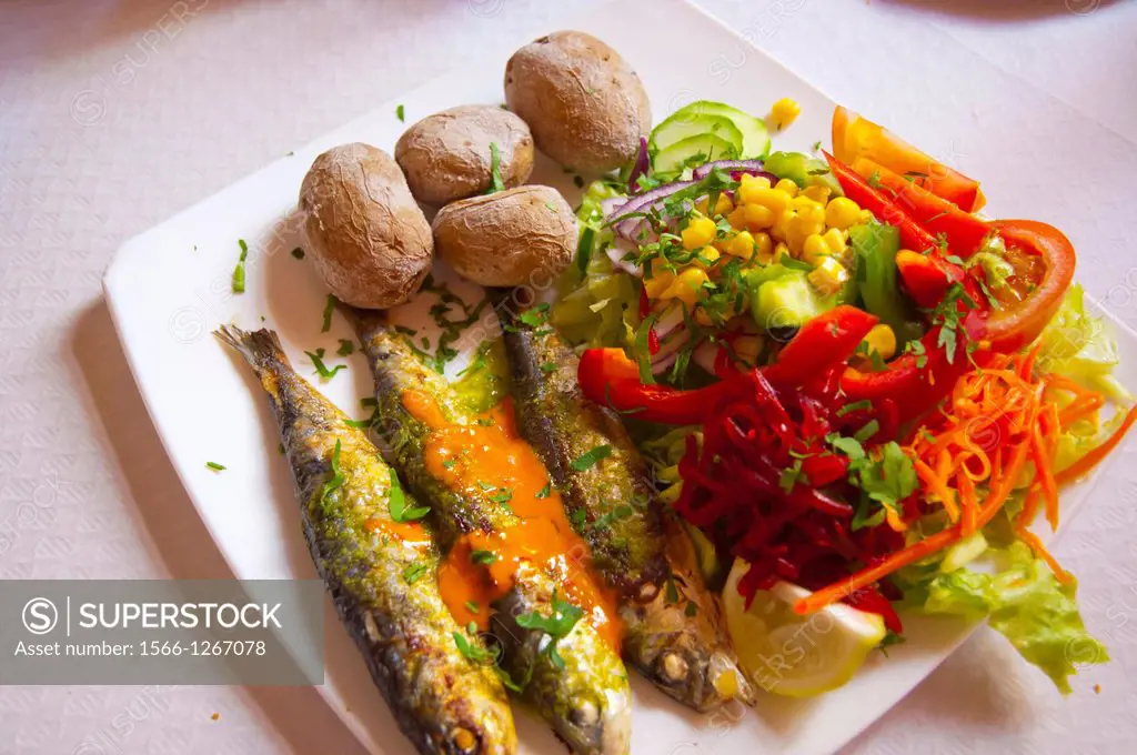 Grilled sardines potatoes and salad in a restaurant San Andres town Tenerife island the Canary Islands Spain Europe