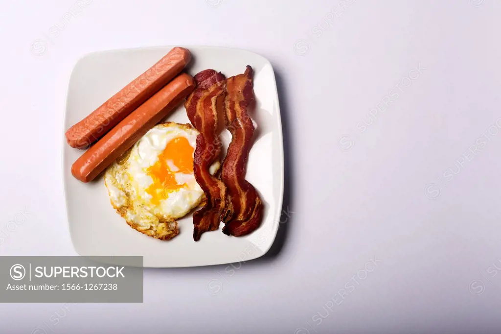 Breakfast with eggs, bacon and sausages